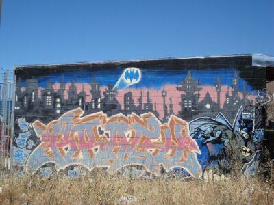 Why Batman Refuses to Take Up the Gun Image